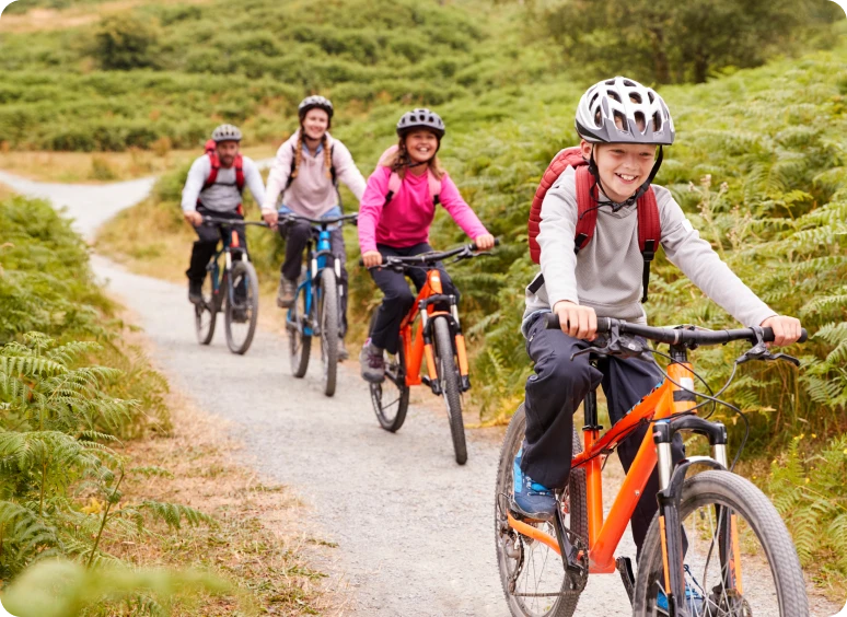 Group cycling through lush greenery