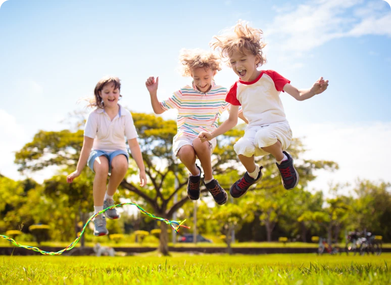 Kids playing outdoors on sunny day