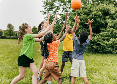 Children playing with a ball outdoors